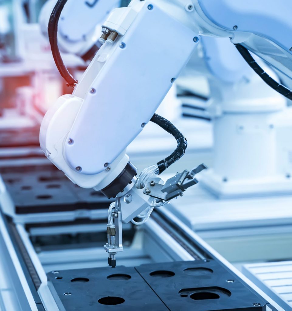 ABB industrial robot integrated into an automated manufacturing system